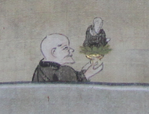 地蔵菩薩を持って避難する僧侶